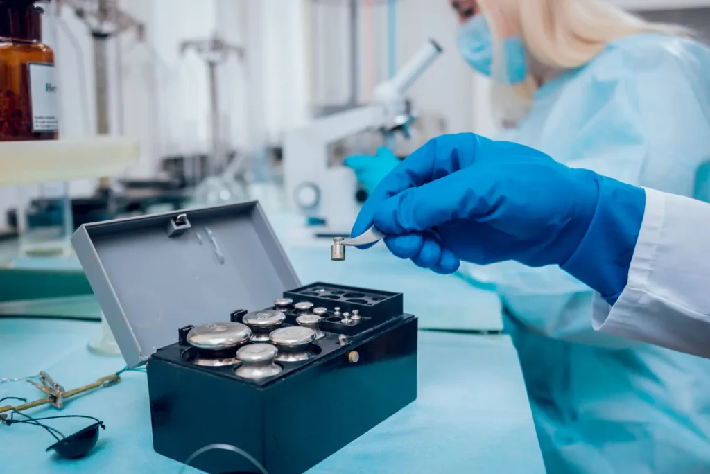 Laboratory technician handling material samples